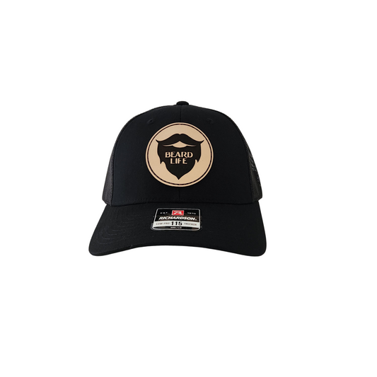 Black mesh trucker hat with beard life leather patch on front