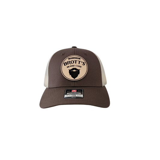 Chocolate chip and birch colored mesh trucker hat with Brott's Beard Care leather patch logo