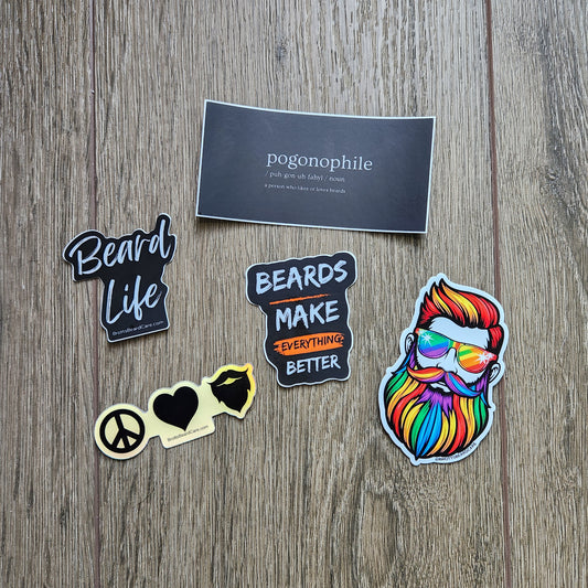 Set of 5 colorful Beard themed stickers on a wooden background